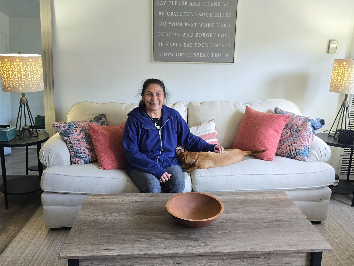 A family in their newly furnished home on Welcoming Day